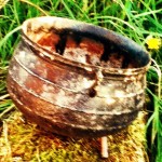 rusty cauldron on a rock - illustrating a story from a series of online stories for kids